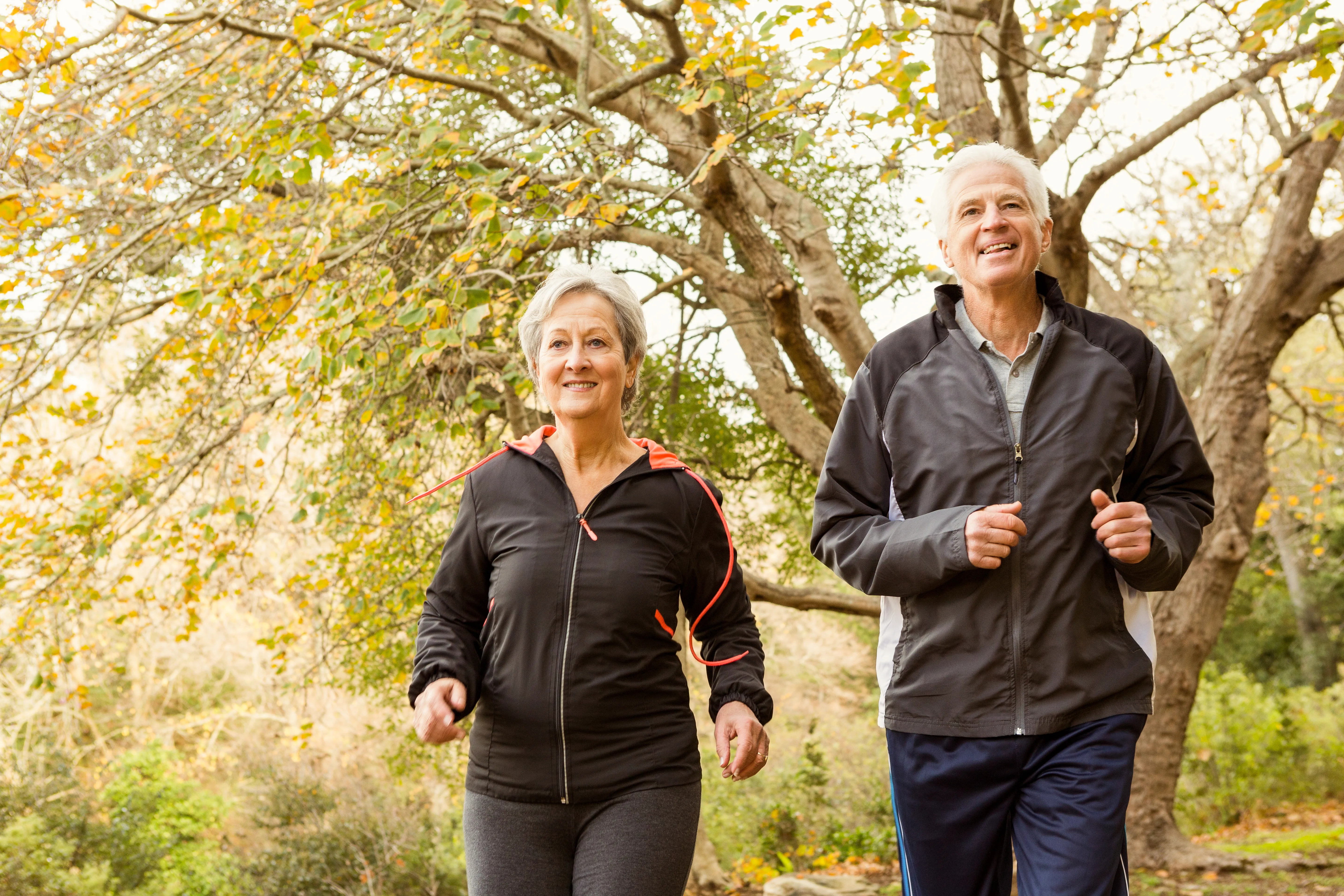 knee injection pain and information showing older couple smiling while running